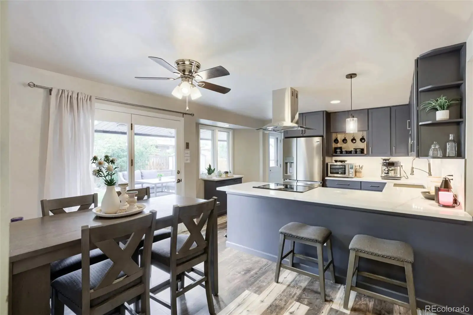 Dining area and remodeled kitchen with peninsula seating