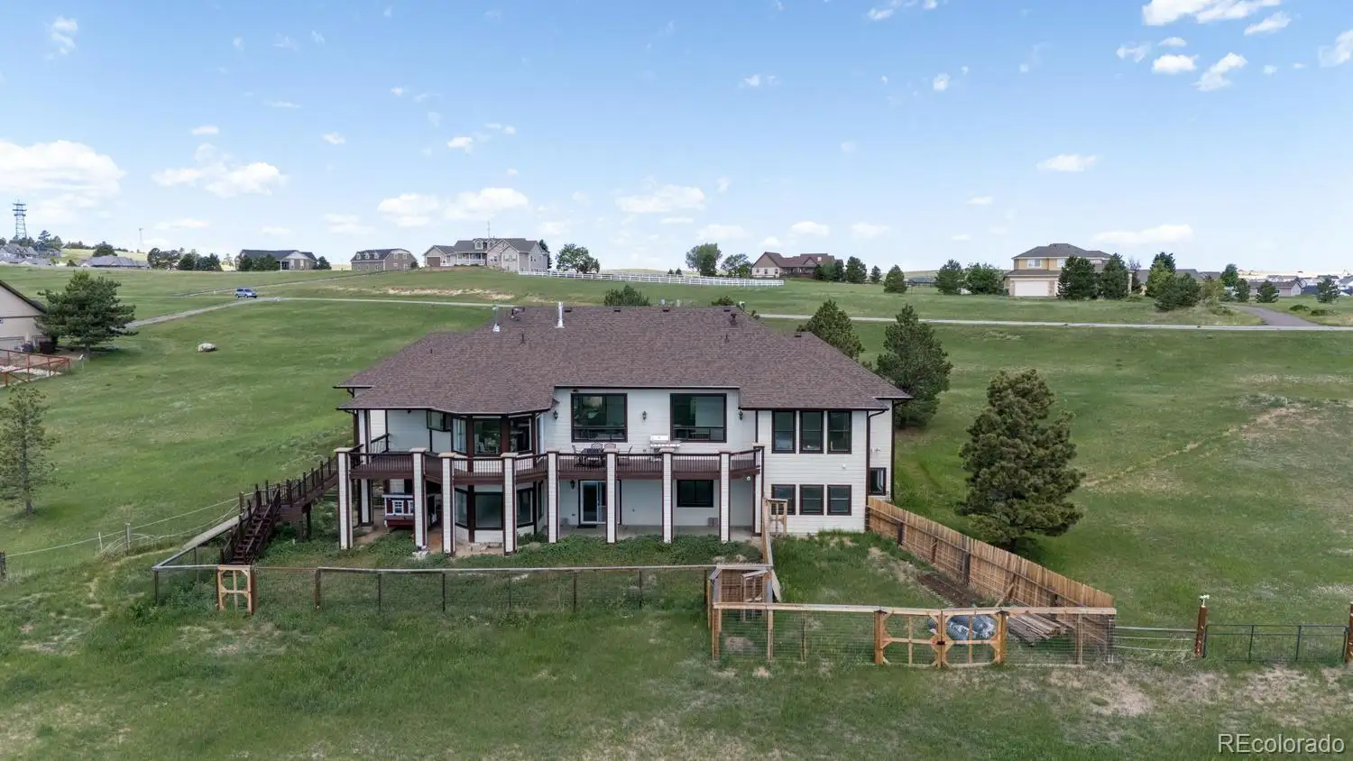 Rear exterior and deck overlooking open pasture