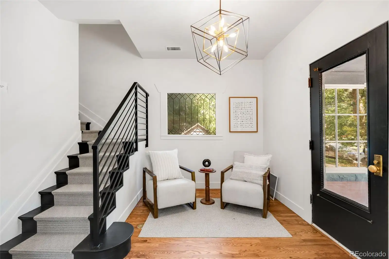 Staircase and sitting corner by the front door