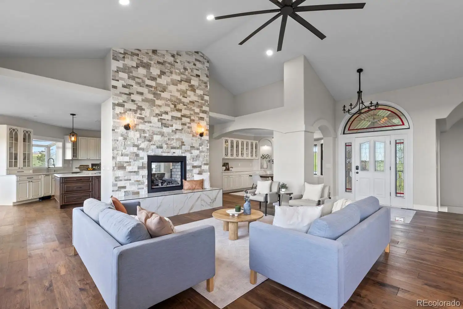 Great room seating around the two-sided fireplace