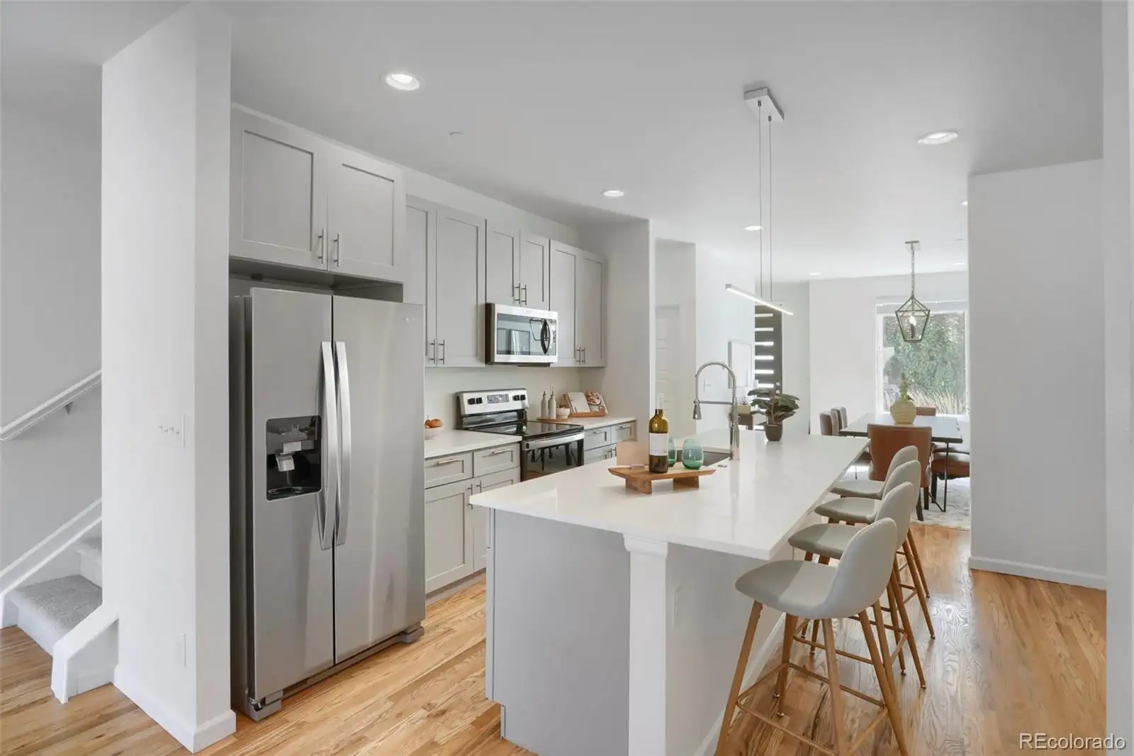 Kitchen island and stainless refrigerator