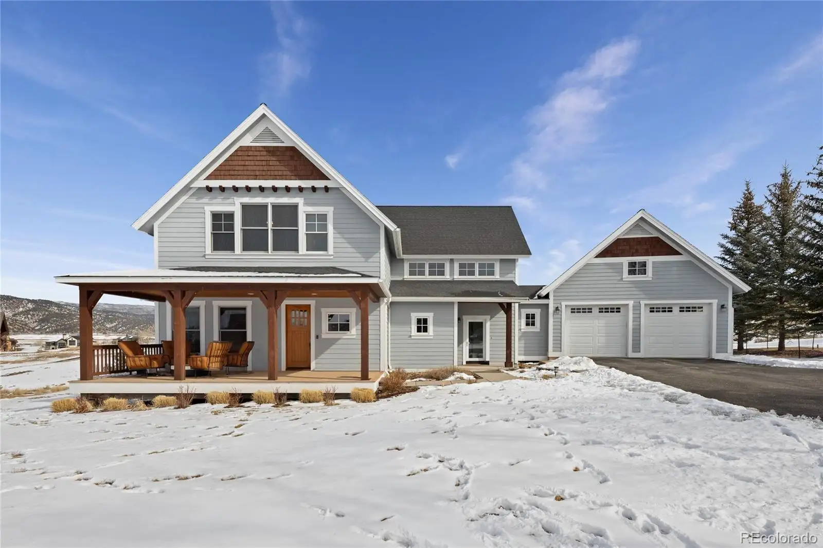 Front exterior and covered porch in winter
