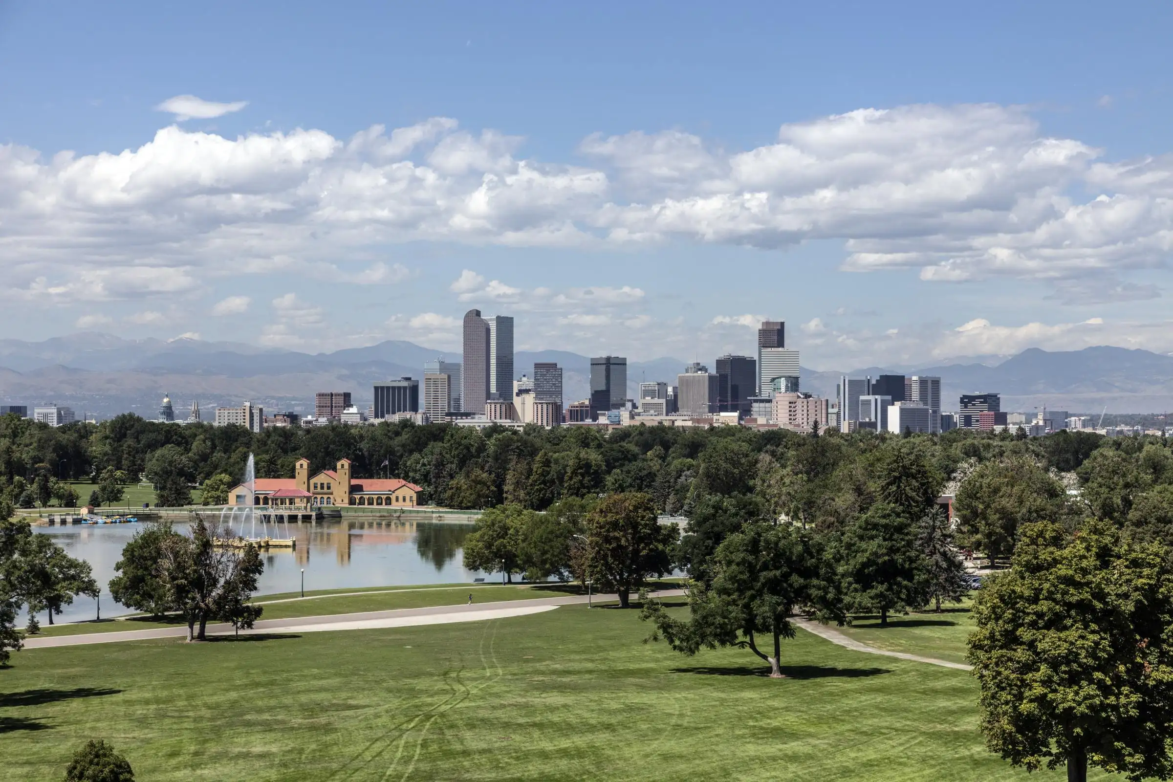 The Denver skyline and the Front Range seen across Ferril Lake in City Park